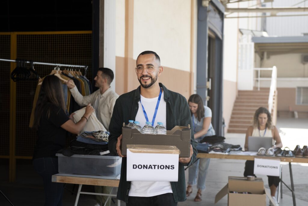 close-up-volunteer-oganizing-stuff-donation